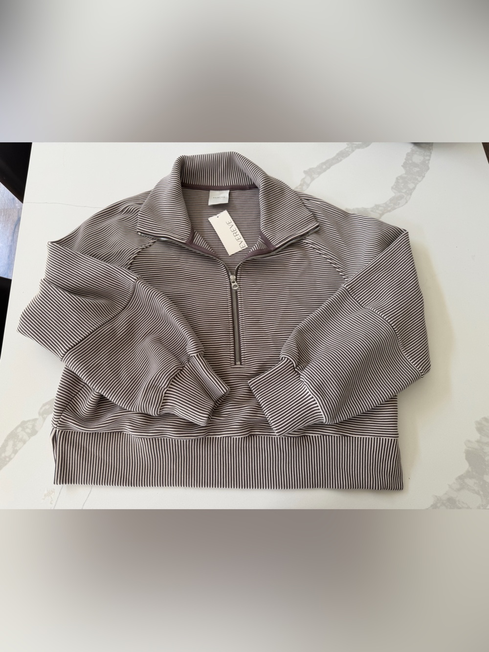 Varley Milano Half-Zip Sweatshirt in a striped brown colorway.
